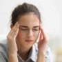 Woman suffering migraine attack